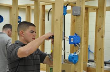 student wiring an electrical panel