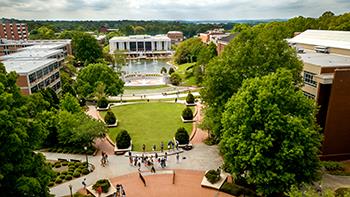 aerial view of university campus with trees and buildings