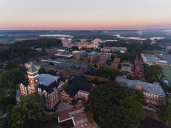 dusk aerial view of university campus with lake