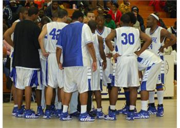 basketball team in a huddle on the court