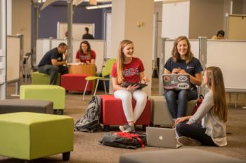 students studying in a modern library setting