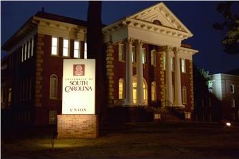 illuminated sign of university of south carolina at night