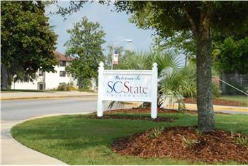 welcome to sc state sign surrounded by greenery