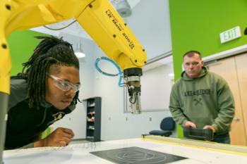 students at robotics workstation