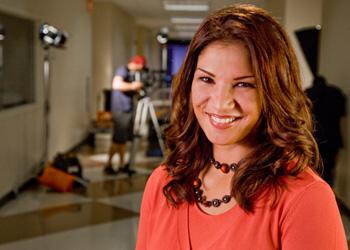 smiling woman in media production set