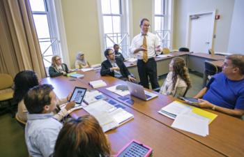 classroom scene with instructor and diverse students