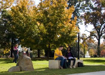 students walking near outdoor campus building