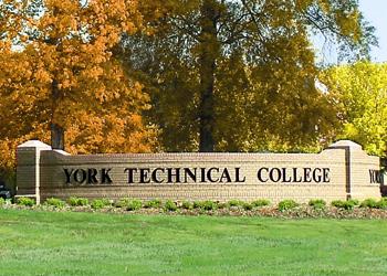 york technical college entrance sign surrounded by foliage